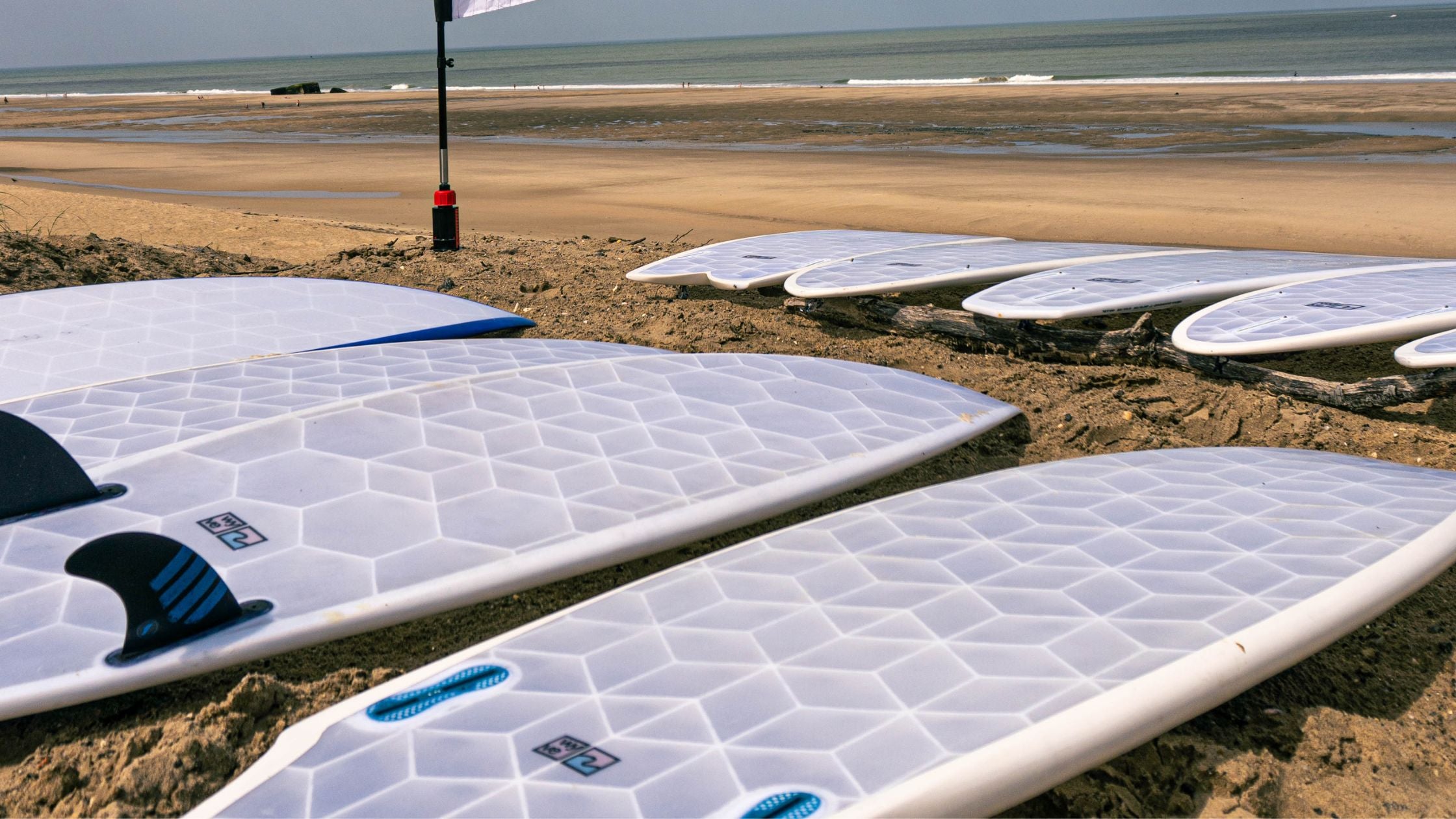 Many Wyve Surfboards on the beach in a demo days in France
